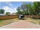 Open backyard features wood privacy fence, lush trees, and a composite deck at 2616 W 134Th Cir, Broomfield, CO 80020