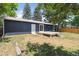 Spacious backyard featuring a composite deck, lush trees, and a wood privacy fence at 2616 W 134Th Cir, Broomfield, CO 80020