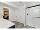 Contemporary bathroom with a walk-in shower and access to the living room at 2616 W 134Th Cir, Broomfield, CO 80020