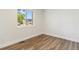 Bright bedroom with wood flooring, a large window, and neutral wall paint at 2616 W 134Th Cir, Broomfield, CO 80020