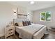 Serene bedroom with a plush bed, decorative pillows, and a bright window view at 2616 W 134Th Cir, Broomfield, CO 80020