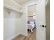 Walk-in closet with shelving and a view into the neutral primary bedroom at 2616 W 134Th Cir, Broomfield, CO 80020