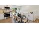 Modern kitchen and dining area with stainless steel appliances and a bright interior at 2616 W 134Th Cir, Broomfield, CO 80020