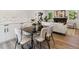 Open dining area with modern furniture and an elegant table setting at 2616 W 134Th Cir, Broomfield, CO 80020