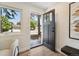 Inviting foyer featuring wood-look floors, a modern door, and a view to the exterior at 2616 W 134Th Cir, Broomfield, CO 80020