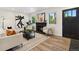 Bright living room featuring a fireplace, hardwood floors, and modern decor at 2616 W 134Th Cir, Broomfield, CO 80020