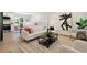 Comfortable living room with hardwood floors, neutral furniture, and modern accents at 2616 W 134Th Cir, Broomfield, CO 80020