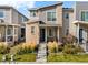 Inviting two-story home with a mix of brick and siding, featuring a well-kept lawn and tidy landscaping at 12273 Karls Ln, Northglenn, CO 80241