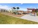 Community playground featuring play structures, a swing set, and a covered picnic area at 12273 Karls Ln, Northglenn, CO 80241