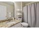 Bathroom featuring granite countertops, a sink, and shelving for storage at 16164 E Hinsdale Ave, Aurora, CO 80016