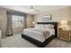 Spacious bedroom with large bed, neutral decor, and window view at 16164 E Hinsdale Ave, Aurora, CO 80016