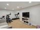 Basement featuring a gym and workout equipment at 16164 E Hinsdale Ave, Aurora, CO 80016