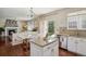 Bright kitchen features white cabinets, granite counters, stainless steel appliances and hardwood floors at 16164 E Hinsdale Ave, Aurora, CO 80016