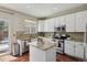 Bright kitchen with white cabinets, granite countertops, and stainless steel appliances at 16164 E Hinsdale Ave, Aurora, CO 80016