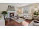 Cozy living room with fireplace, zebra art, and plush seating at 16164 E Hinsdale Ave, Aurora, CO 80016