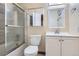 Updated bathroom featuring a shower with glass door, vanity, and modern fixtures at 13343 E Louisiana Ave, Aurora, CO 80012