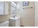 Well-lit bathroom featuring a white vanity and updated fixtures at 13343 E Louisiana Ave, Aurora, CO 80012