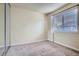 Bedroom featuring carpeting and a window that provides plenty of natural light at 13343 E Louisiana Ave, Aurora, CO 80012