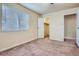 Bright bedroom with neutral walls, closet access, and window blinds at 13343 E Louisiana Ave, Aurora, CO 80012