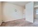 Bedroom includes neutral wall color, carpet, and a mirrored sliding-door closet at 13343 E Louisiana Ave, Aurora, CO 80012