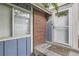 Charming entryway with a white door and brick accents at 13343 E Louisiana Ave, Aurora, CO 80012