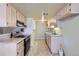 Functional kitchen with modern appliances, granite countertops, and ample cabinet space for storage at 13343 E Louisiana Ave, Aurora, CO 80012