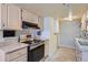 Efficient kitchen area with modern appliances, stylish countertops, and ample storage for cooking essentials at 13343 E Louisiana Ave, Aurora, CO 80012