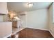 Cozy kitchen and dining area with neutral cabinets and vinyl flooring at 13343 E Louisiana Ave, Aurora, CO 80012