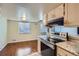 Well-lit kitchen area featuring modern appliances, ample counter space, and a functional layout for cooking at 13343 E Louisiana Ave, Aurora, CO 80012