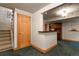 Basement entryway with wood-framed door and staircase access at 10732 W Florida Ave # B, Lakewood, CO 80232