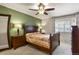 Comfortable bedroom with a ceiling fan, decorative lamps, and a large window with stylish shutters at 10732 W Florida Ave # B, Lakewood, CO 80232