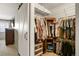 Walk-in closet with ample storage space and custom shelving at 10732 W Florida Ave # B, Lakewood, CO 80232
