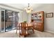 Bright dining room with sliding doors, elegant chandelier, and wooden furniture at 10732 W Florida Ave # B, Lakewood, CO 80232