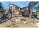 Charming townhome with well-maintained landscaping and a cozy outdoor seating area at 10732 W Florida Ave # B, Lakewood, CO 80232