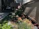 Landscaping featuring a garden with flowers, rocks, and whimsical mushroom decorations at 10732 W Florida Ave # B, Lakewood, CO 80232