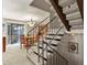 Stylish staircase leading to the upper level, with a view of the dining area at 10732 W Florida Ave # B, Lakewood, CO 80232