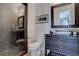 Clean bathroom with a walk-in shower and floating vanity at 10541 Leonardo Pl, Littleton, CO 80125