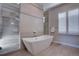 Spa-like bathroom featuring a soaking tub and a large shower at 10541 Leonardo Pl, Littleton, CO 80125