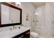 Modern bathroom with marble vanity and a walk-in shower at 10541 Leonardo Pl, Littleton, CO 80125