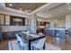 Elegant dining room features a modern table, stylish chairs, and built-in cabinetry at 10541 Leonardo Pl, Littleton, CO 80125