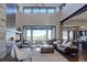 Elegant living room with a modern fireplace and access to a deck at 10541 Leonardo Pl, Littleton, CO 80125