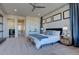 Serene main bedroom with a king-size bed, ensuite access, and ample natural light at 10541 Leonardo Pl, Littleton, CO 80125