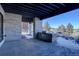 Covered patio features built-in grill and stunning mountain views at 10541 Leonardo Pl, Littleton, CO 80125