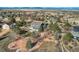 An expansive home with scenic views sits in a landscaped yard, framed by mature trees and neighboring houses at 14652 Beeler St, Brighton, CO 80602