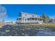 This property features a spacious backyard with a large deck and a well-maintained lawn at 14652 Beeler St, Brighton, CO 80602