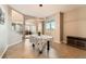Open-concept dining room with tile flooring and natural light flowing throughout the living spaces at 14652 Beeler St, Brighton, CO 80602