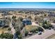 Expansive home showcases mature landscaping, a wraparound porch, and a multi-car garage in a serene, rural setting at 14652 Beeler St, Brighton, CO 80602
