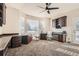 Spacious office area with custom built-ins, plush carpet, and a large window at 14652 Beeler St, Brighton, CO 80602