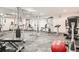 Fully equipped gym with weight machines and mirrored walls at 3315 S Monaco St # B, Denver, CO 80222