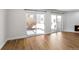Living room featuring hardwood floors and sliding glass doors at 3315 S Monaco St # B, Denver, CO 80222
